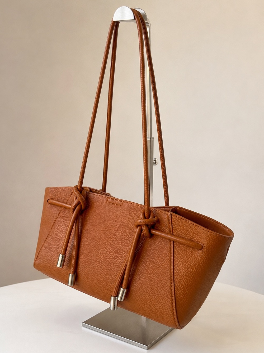 Cognac Vegan Pebbled Leather Knott Strap Minimalist Sculptural Shoulder Bag